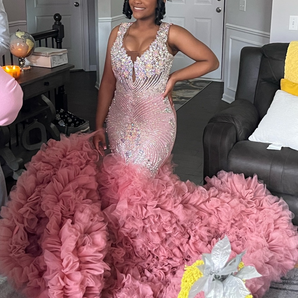 Prom dress, size ranging from 4-6 color is blush pink with iridescent bodice top